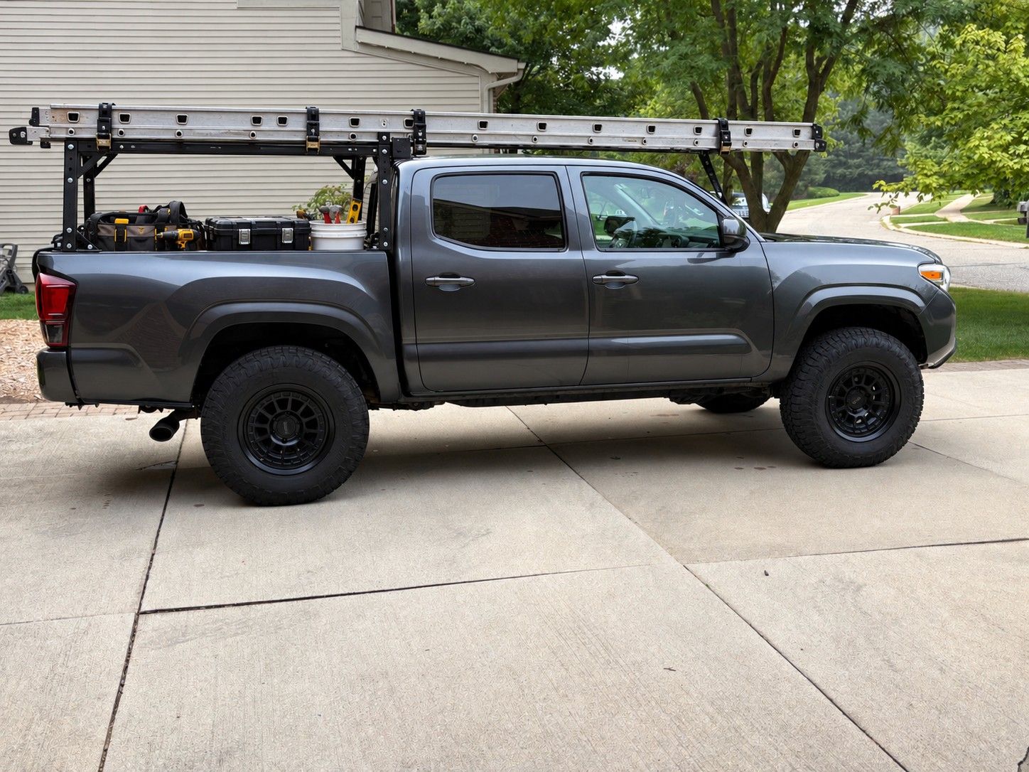 Kristian's Tacoma with a ladder rack and tools in the bed