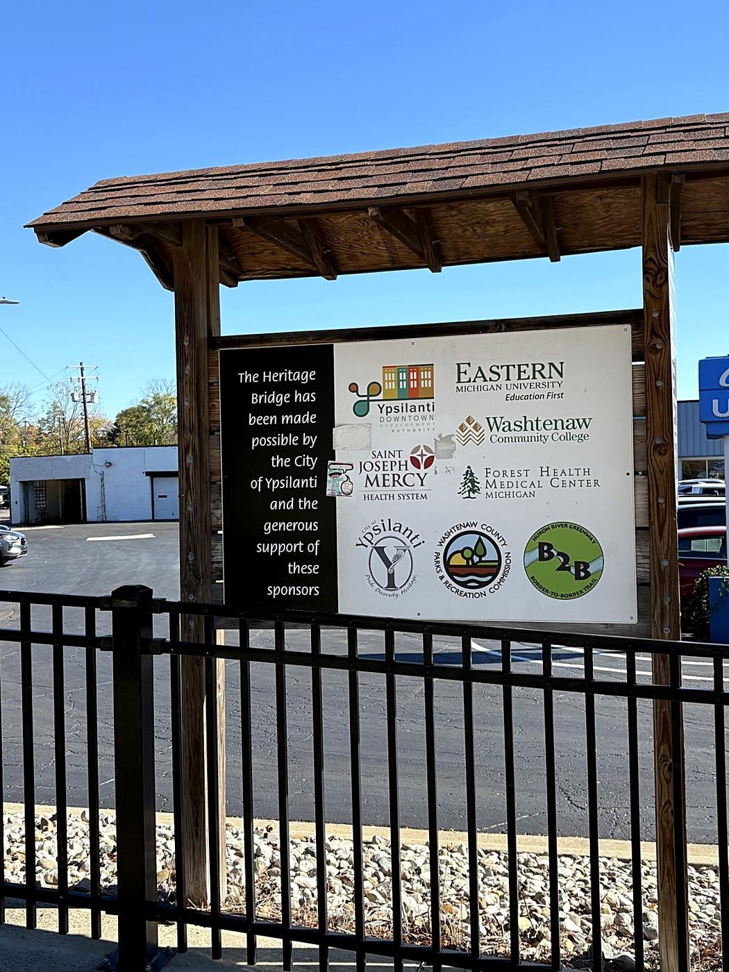 The Heritage Bridge sign, with the Border-to-Border Trail logo